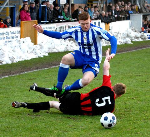 JUMP TO IT: Worcester City goal-scorer Danny Glover hurdles Histon’s Danny Fitzsimmons in the 3-2 Blue Square Bet North defeat at St George’s Lane.