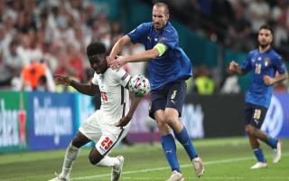 Italy’s Giorgio Chiellini pulls back England’s Bukayo Saka during the Euro2020 final (PA)