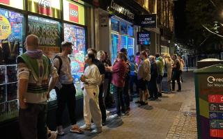 LONG QUEUE: People wait patiently outside Toys and Games of Worcester in Broad Street