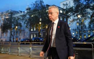 Michael Gove was escorted by police as he made his way through London Victoria