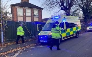 HURT: An ambulance on Stanley Road after the boy, six, was knocked down
