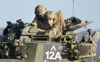 The Prince of Wales took part in a mock attack as a gunner on the infantry fighting vehicle