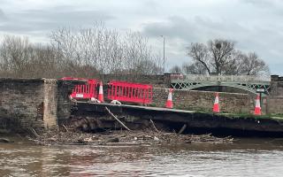WOUND: Driftwood and other debris piled against the collapsed section of Powick Old Bridge, taken on  Sunday 25/2/24