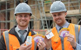 Barratt Homes' Matt Creed (site manager, left) and George Fisher (assistant site manager, right) with the UV gauge cards