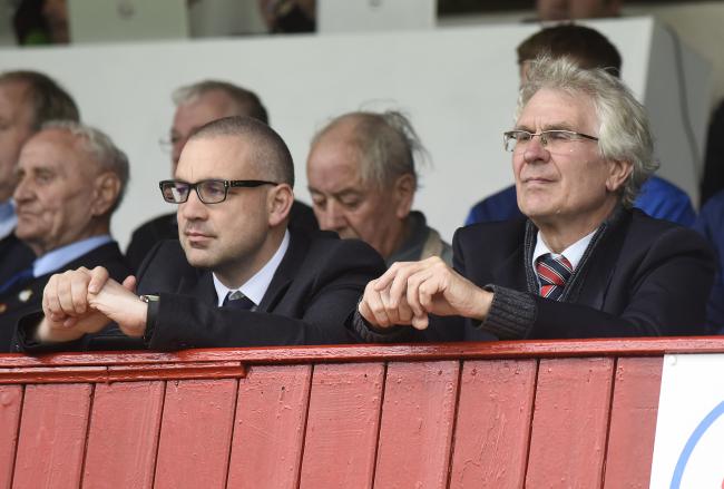 Worcester City chairman Anthony Hampson (right) watches on at the Victoria Ground.